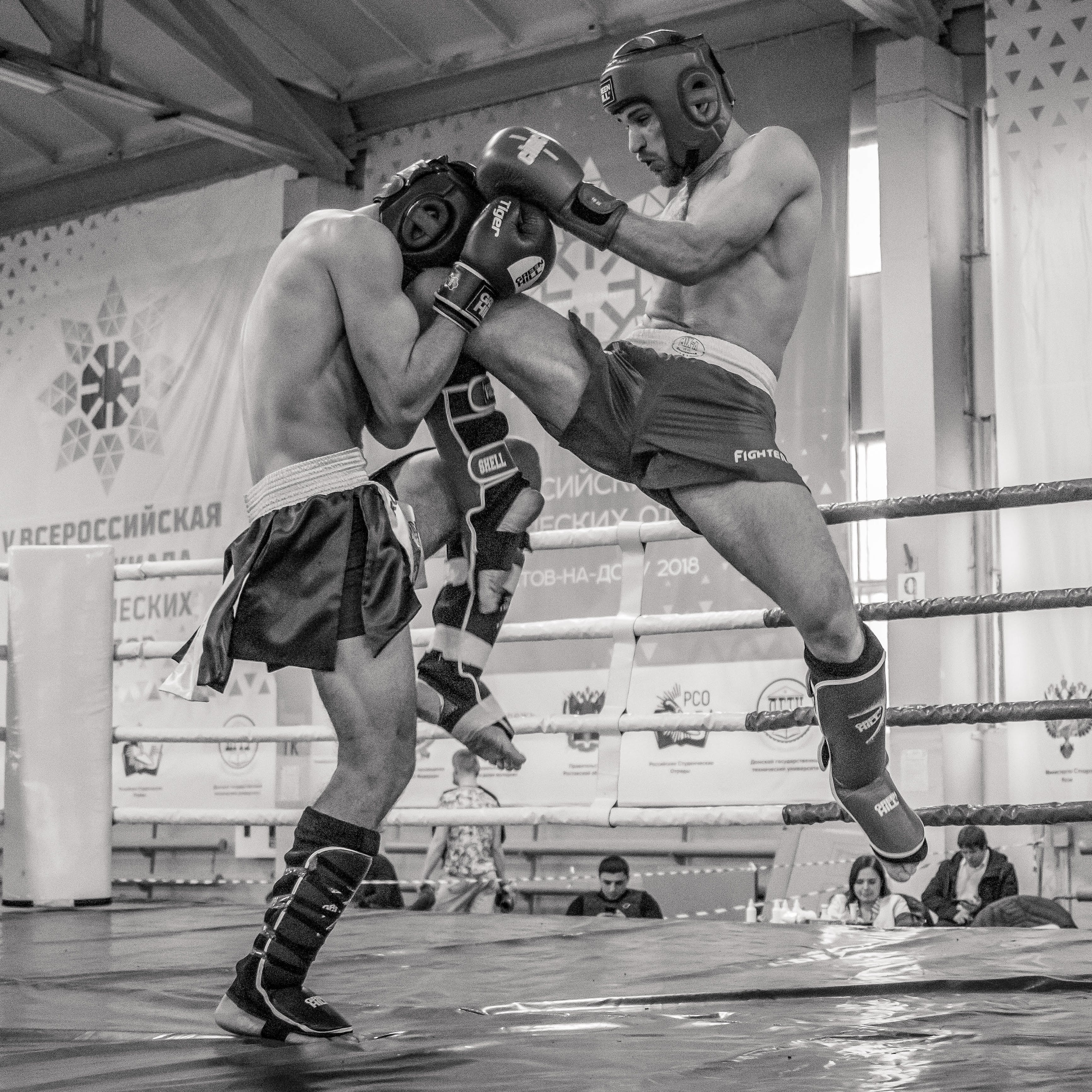 two guys kickboxing